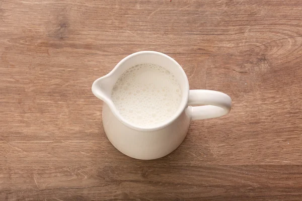 White pitcher with milk