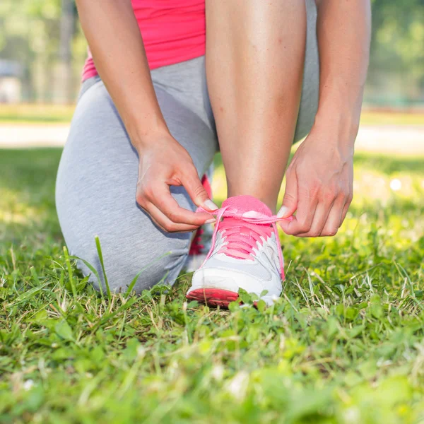 Fitness Woman Tying Shoelaces