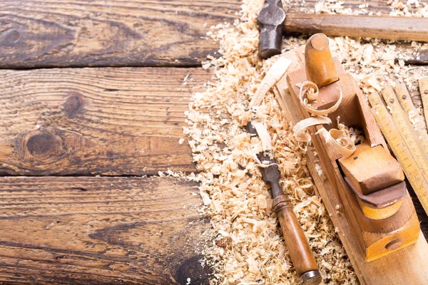 Old tools: wooden planer, hammer, chisel