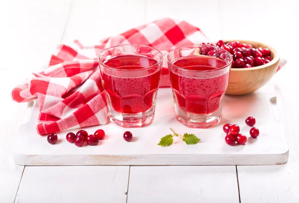 Glasses of cranberry juice with fresh berries