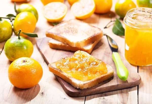 Toast with orange mandarin marmalade with fresh fruits