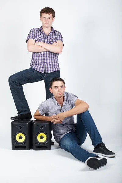 Two funny boys with speakers