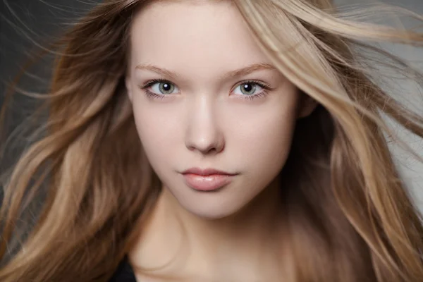 Beautiful girl portrait with windy hair