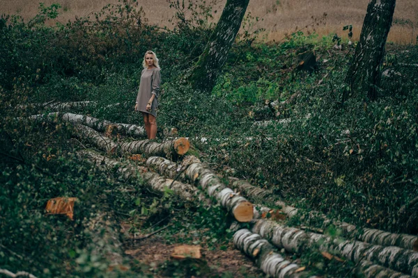 Beautiful girl in the felled forest