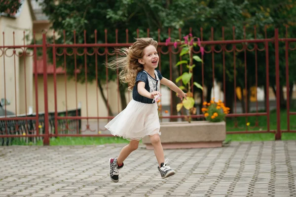 Young happy girl running away