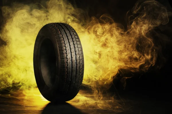 Photo of black smoked burning tire