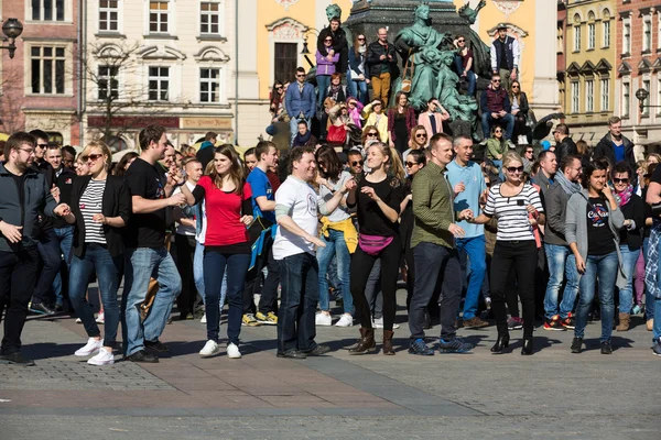 International Flashmob Day of Rueda de Casino, 57 countries, 160 cities. Several hundred persons dance Hispanic rhythms on the Main Square in Cracow. Poland