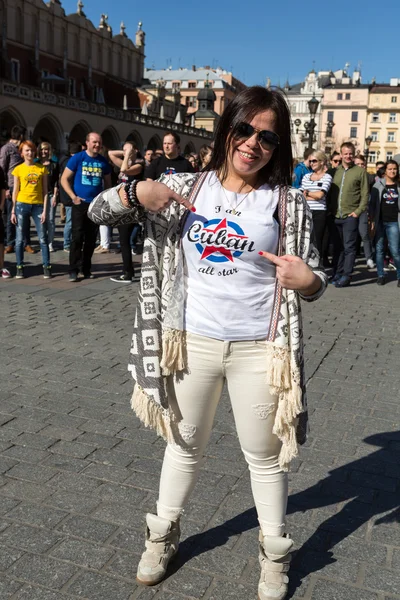 International Flashmob Day of Rueda de Casino, 57 countries, 160 cities. Several hundred persons dance Hispanic rhythms on the Main Square in Cracow. Poland