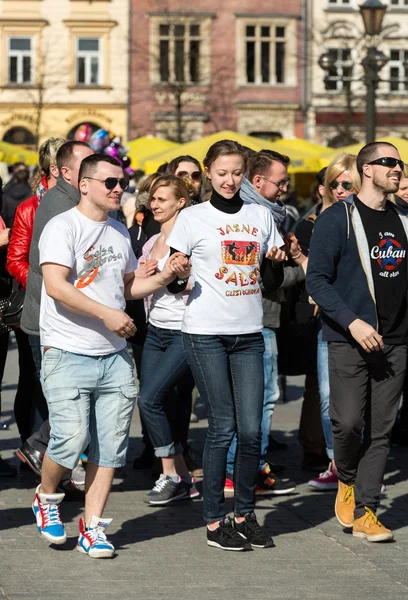 International Flashmob Day of Rueda de Casino, 57 countries, 160 cities. Several hundred persons dance Hispanic rhythms on the Main Square in Cracow. Poland