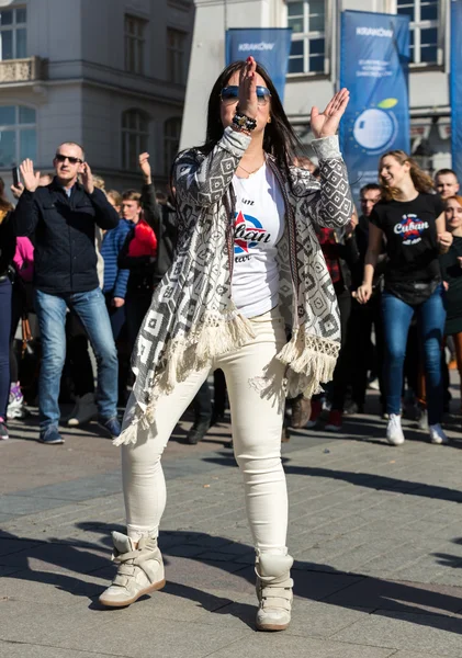 International Flashmob Day of Rueda de Casino, 57 countries, 160 cities. Several hundred persons dance Hispanic rhythms on the Main Square in Cracow. Poland