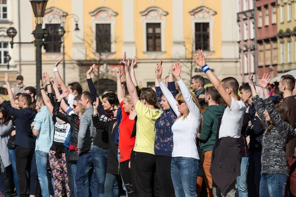 International Flashmob Day of Rueda de Casino, 57 countries, 160 cities. Several hundred persons dance Hispanic rhythms on the Main Square in Cracow. Poland