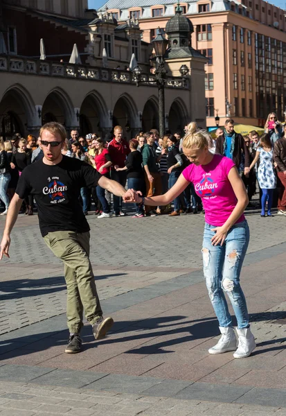 International Flashmob Day of Rueda de Casino, 57 countries, 160 cities. Several hundred persons dance Hispanic rhythms on the Main Square in Cracow. Poland