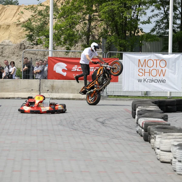 A stunt rider on a sport bike at 3rd edition of MOTO SHOW in Cracow. Poland.