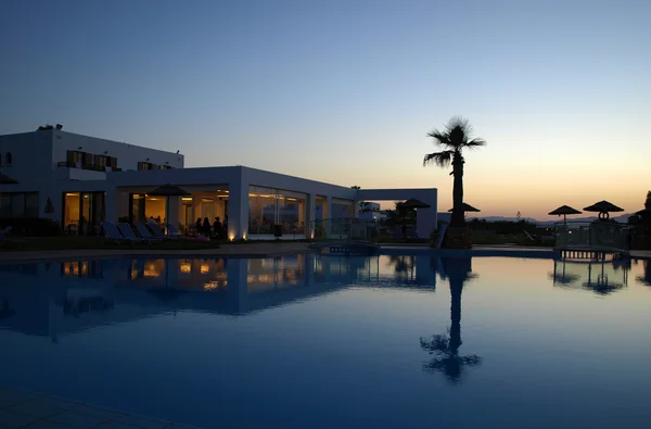 Swimming pool of luxury hotel at dusk