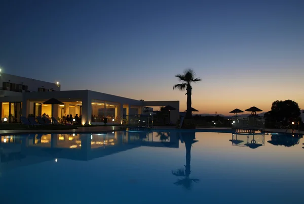 Swimming pool of luxury hotel at dusk