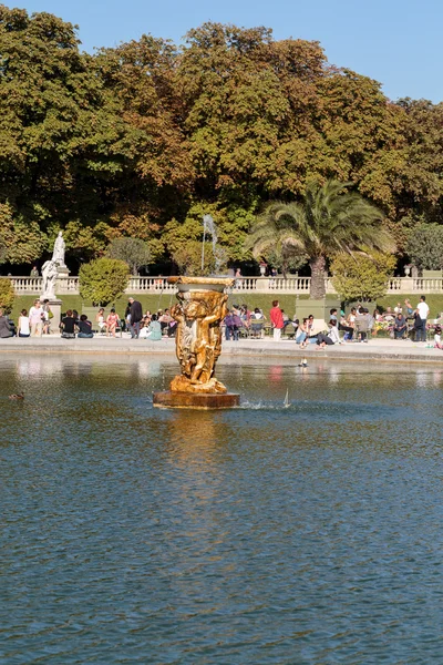 People relax in Luxembourg Gardens in Paris, France. Luxembourg area is popular among tourists in Paris, the most visited city worldwide.