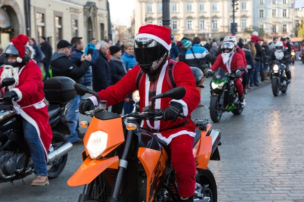 The parade of Santa Clauses on motorcycles around the Main Market Square in Cracow.