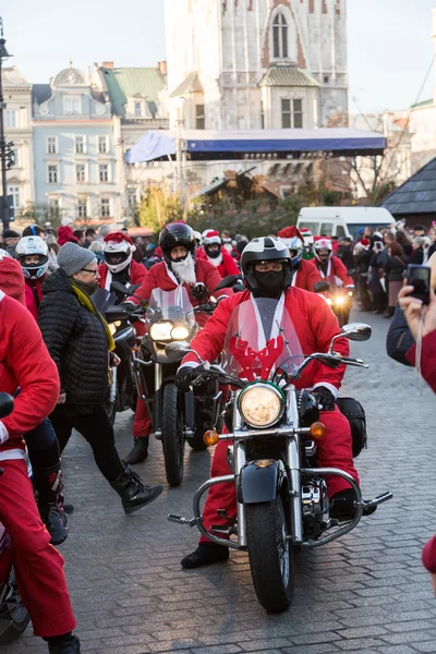 The parade of Santa Clauses on motorcycles around the Main Market Square in Cracow. Poland