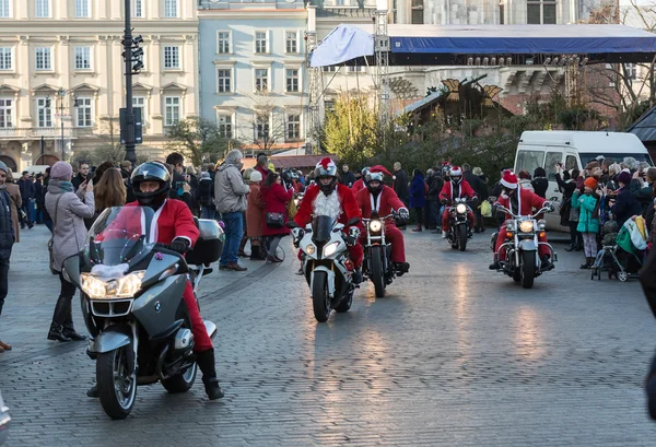 The parade of Santa Clauses on motorcycles around the Main Market Square in Cracow. Poland