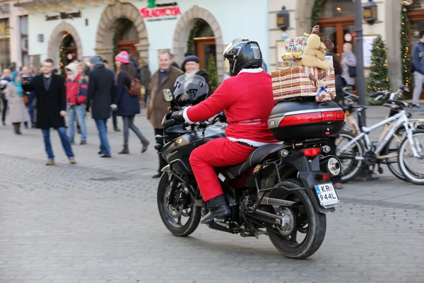 The parade of Santa Clauses on motorcycles around the Main Market Square in Cracow. Poland