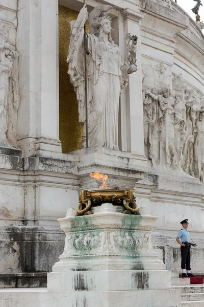 : Rome - National Monument to Victor Emmanuel II. Tomb of the Unknown Soldier, under the statue of goddess Roma, with the eternal flame