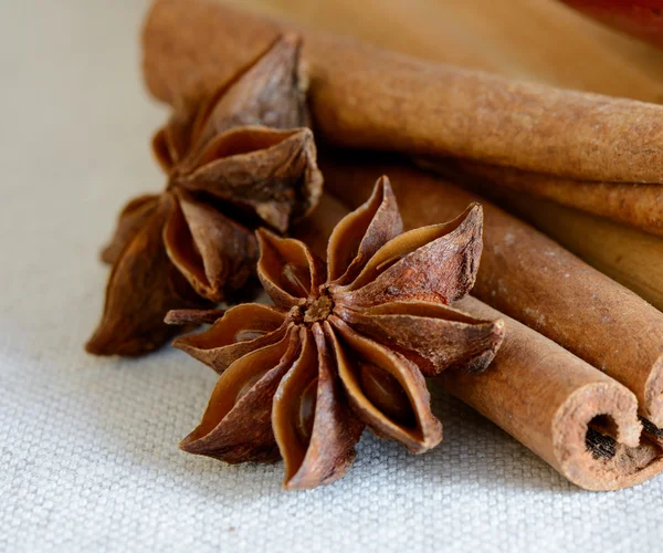 Star Anise and Cinnamon Sticks on Wooden Board