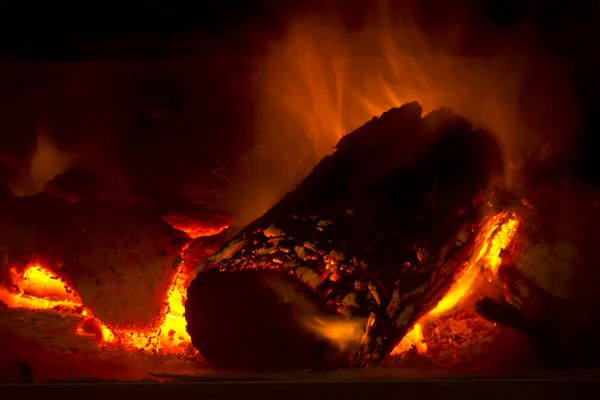 Closeup of Burning Hot Log Fire in Potbelly Stove