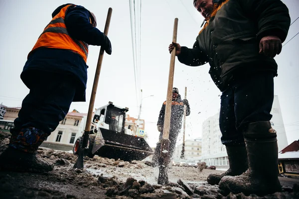 Snow clearance workers. Russia, city Ufa - Febrary 21 2016.