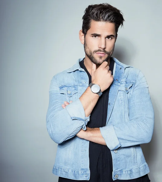 Handsome young man in jeans jacket