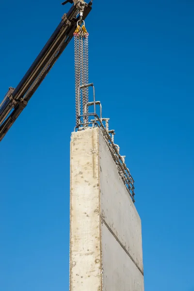 Crane removing concrete encasement