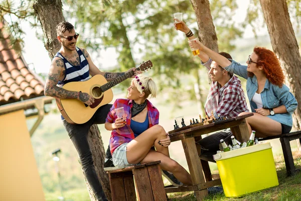Music, guitar and cold beer makes young people happy