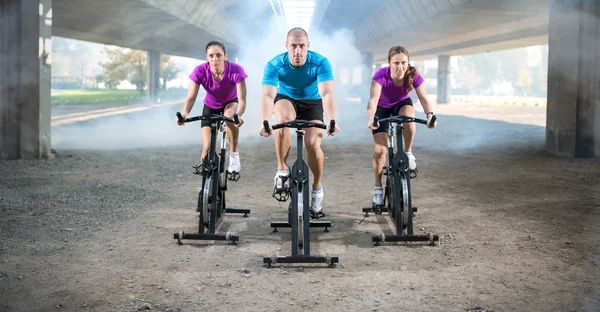 Group of people doing spinning on cycle bike