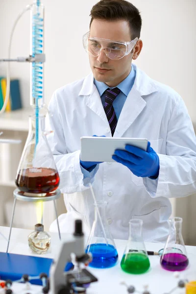 Scientist using data in laboratory