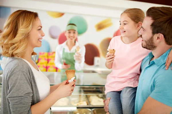 Family eating ice cream in bakery