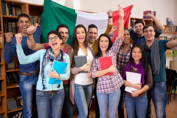 Happy students smiling and presenting Italian country with flag