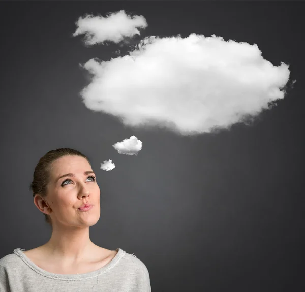 Young woman thinking with cloud