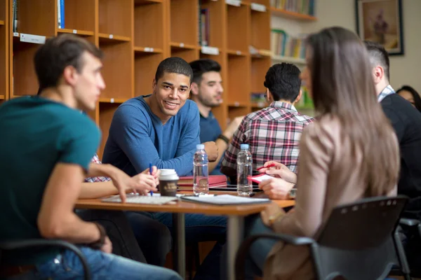 Latino American student socializing with friends