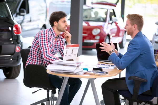 Car agent talking with customer