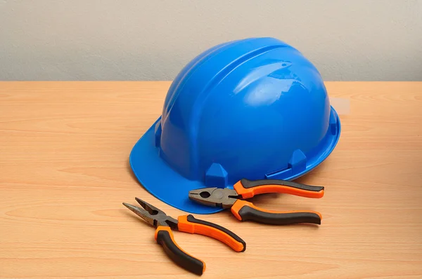 Hard hat and pliers