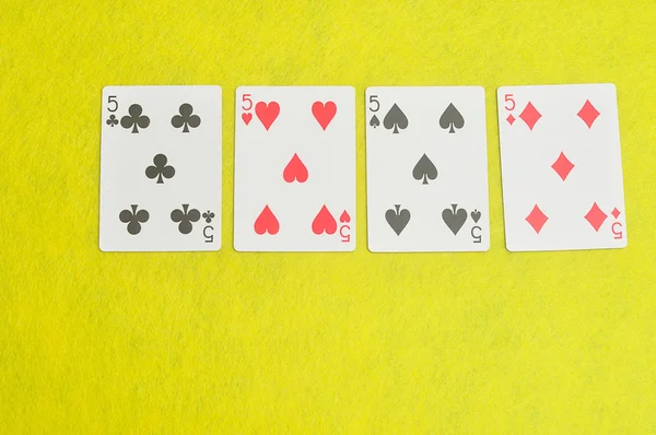 The different suit of the number 5 cards in a deck of cards
