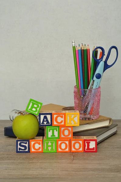 The words back to school spelled with colorful alphabet blocks