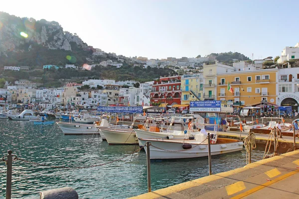 Tour boat booths, signs and buildings at Marina Grande, Capri, I