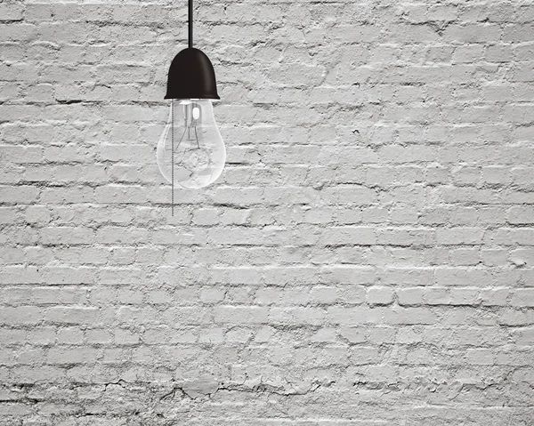 Hanging light bulb with bricks wall