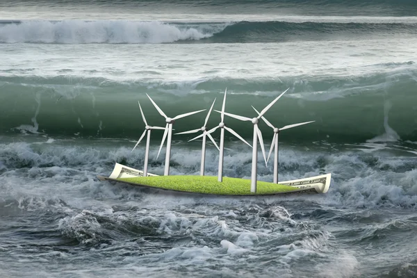 Wind turbines on money boat with oncoming wave in ocean