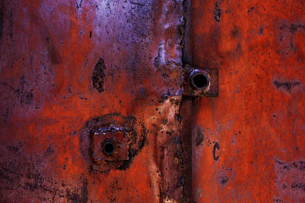 Old metal background with cracked paint and rust