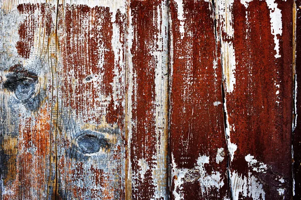 Natural wood background with old cracked paint from a long time