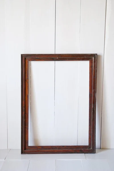 Frame picture in the empty room from wooden board wall and wooden floor.