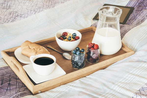 Breakfast in bed, tray with a light meal and coffee