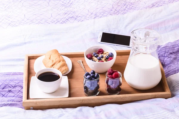 Breakfast in bed, tray with a light meal and coffee