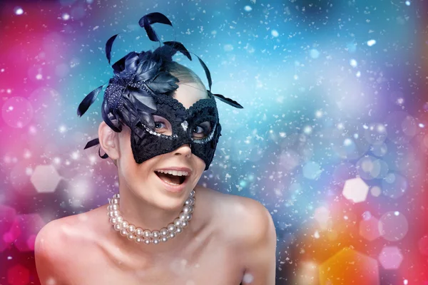 Woman with black masquerade mask with feathers